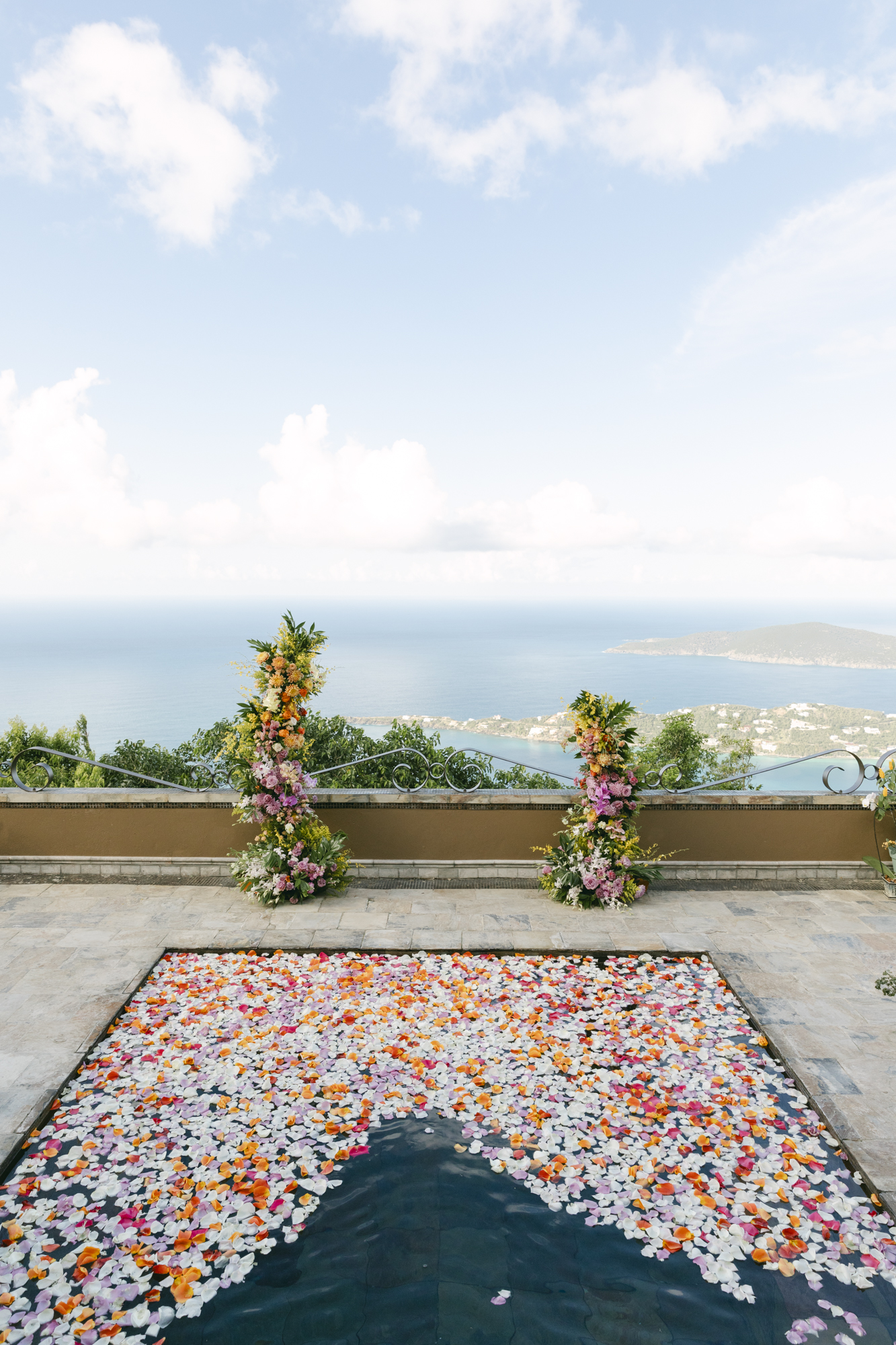 Small and luxurious tropical destination wedding on St. Thomas Virgin Island with vibrant tropical floral arrangements.