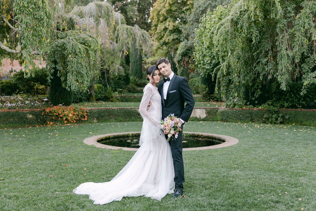 bride and groom walking around their luxurious wedding venue