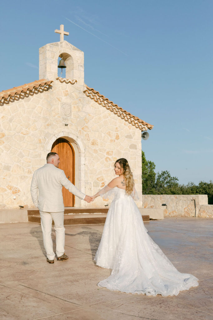 picture of the bride and groom holding hands