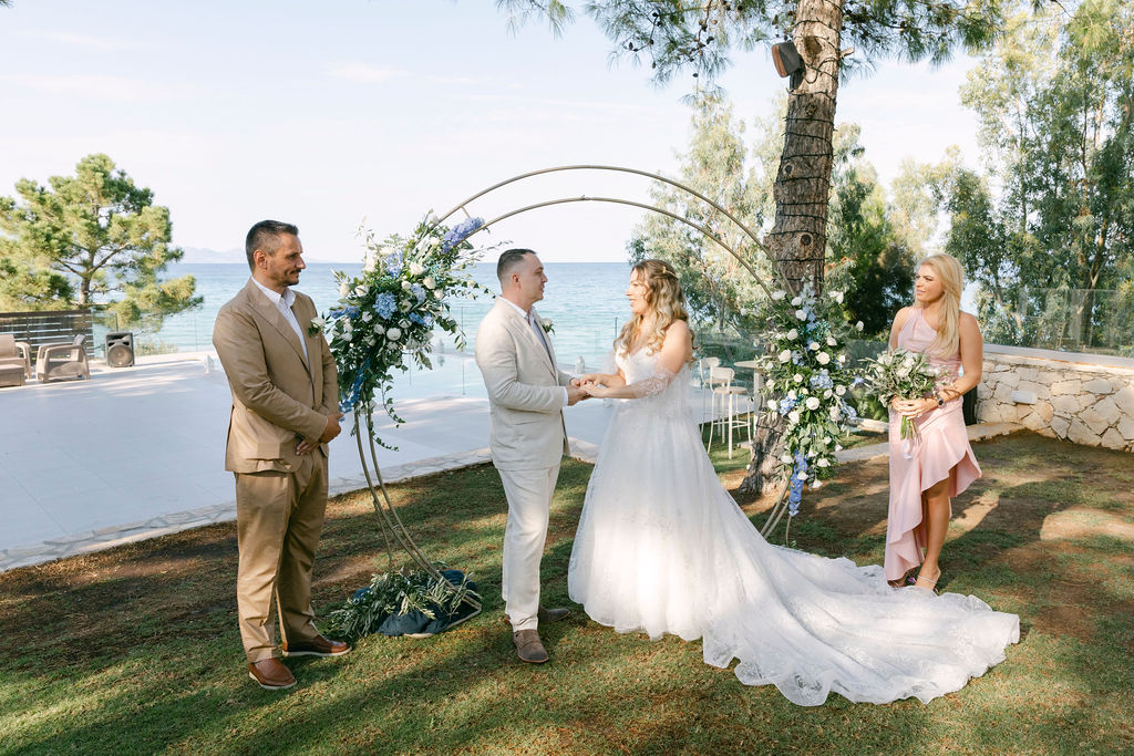 bride and groom holding hands at their wedding ceremony