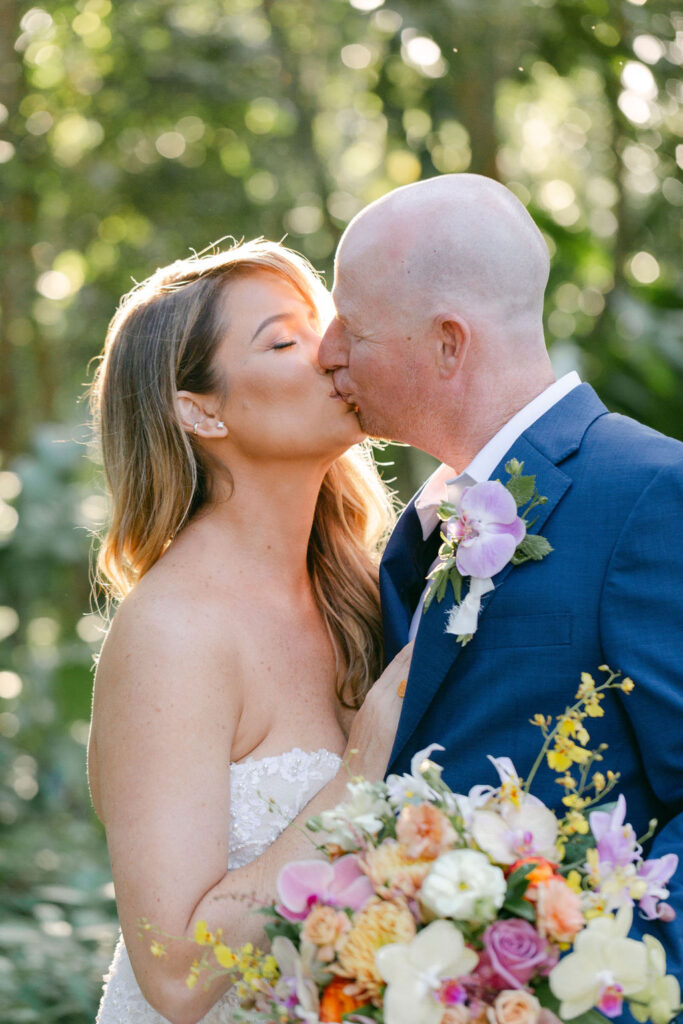 portrait of the bride and groom kissing