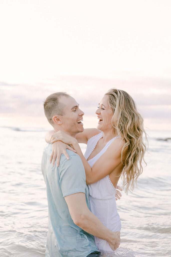 happy couple laughing with each other 