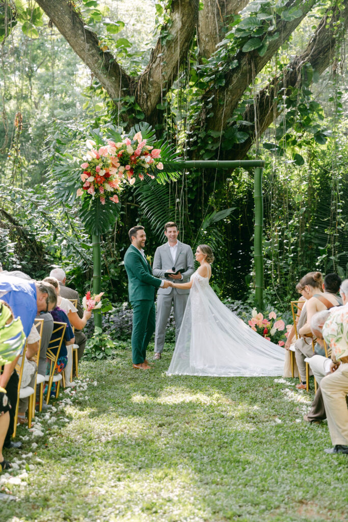 bride and groom holding hands at their wedding ceremony