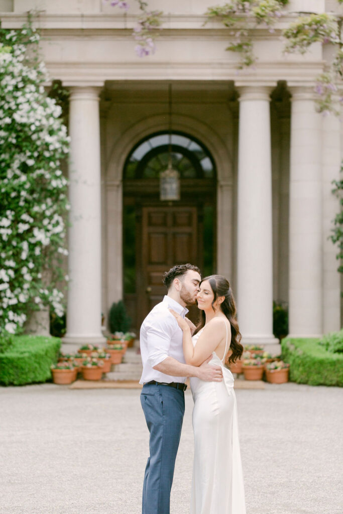 fiance kissing his fiance on the cheek