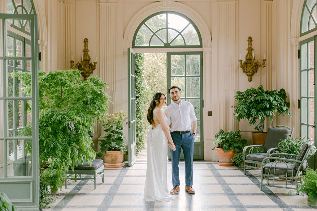 newly engaged couple holding hands