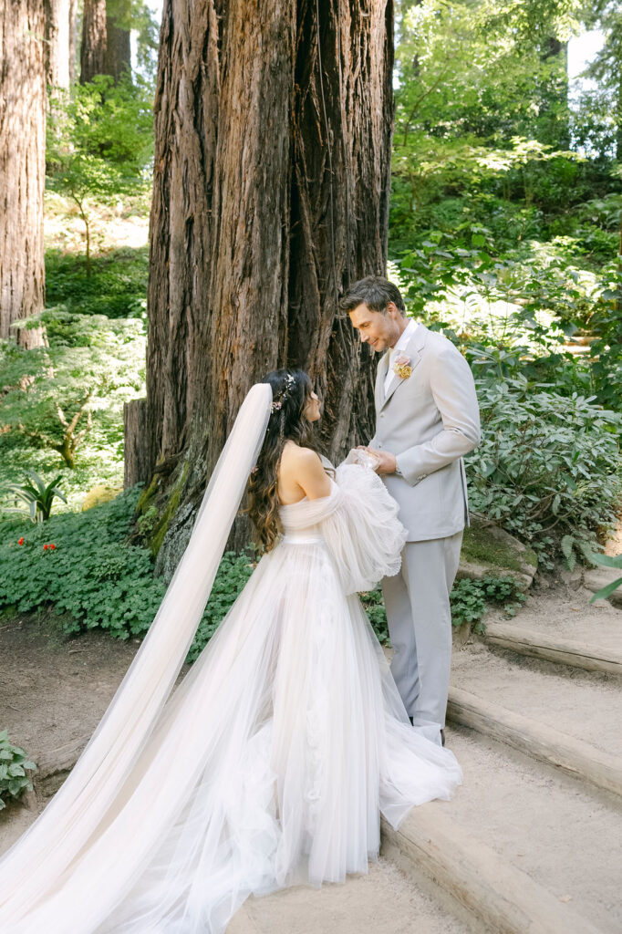 groom emotional seeing the bride in her wedding guest for the first time 