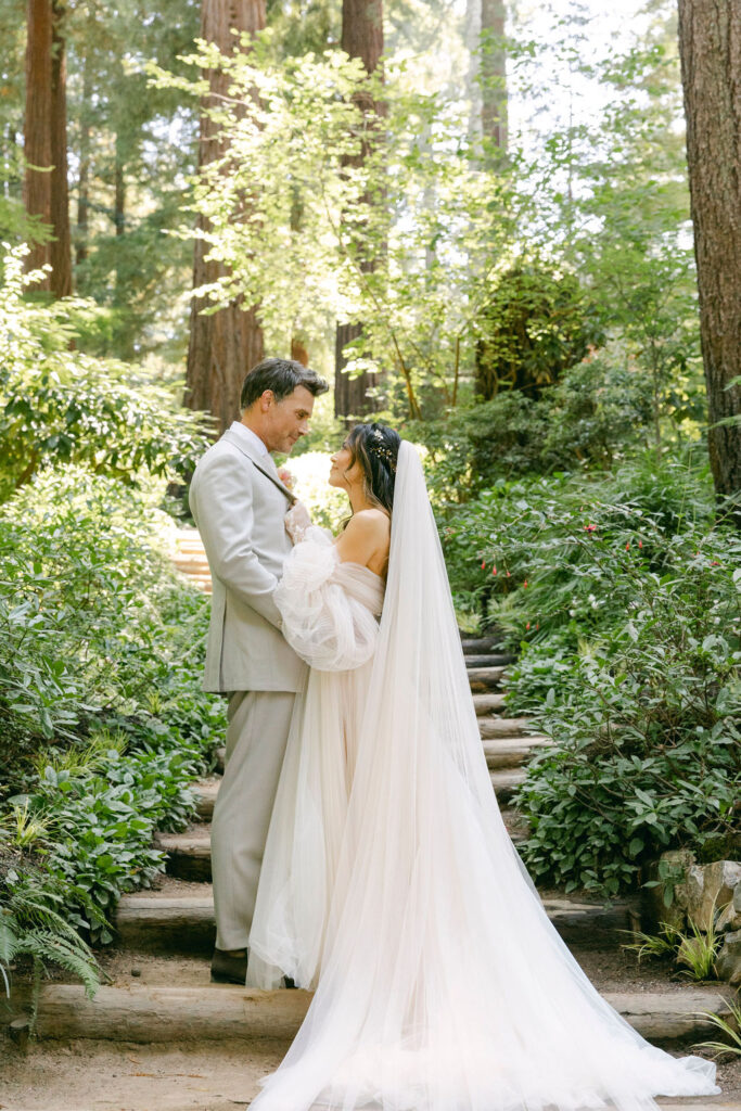 bride and groom looking at each other 