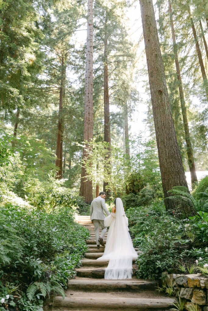 bride and groom walking around their romantic wedding venue 