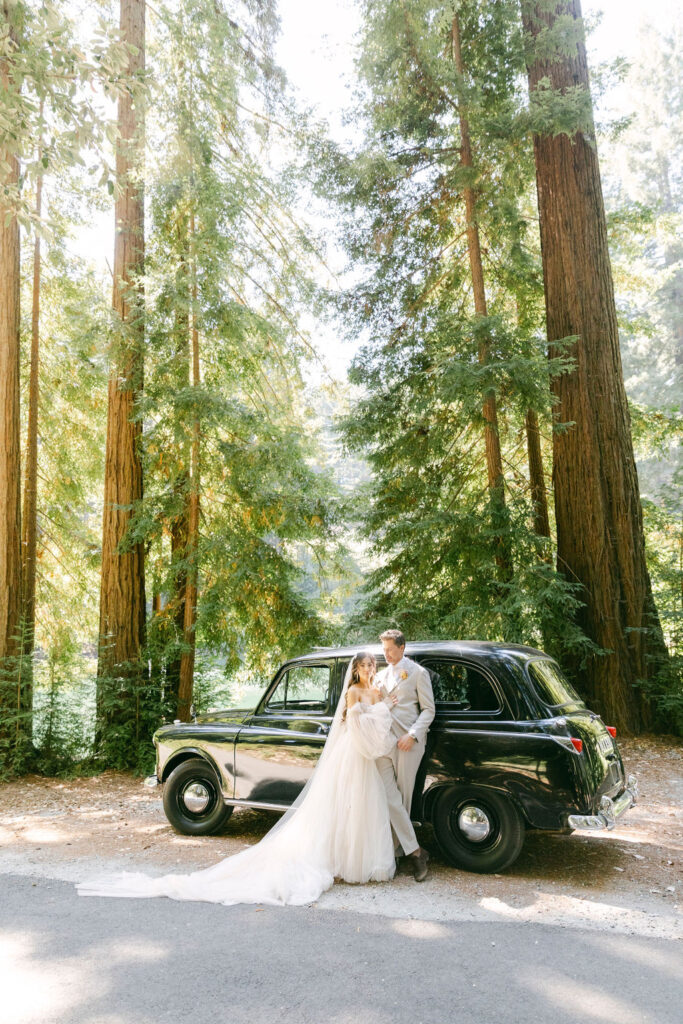 picture of the bride and groom with a vintage car 