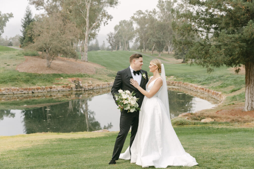 bride and groom doing their sunset photos by a pond on a golf course. golf course wedding ideas. Stunning Country Club Wedding Venues in California