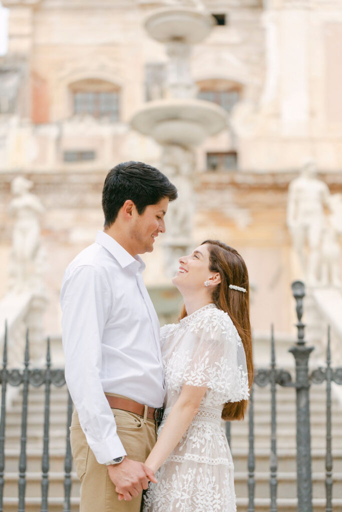 cute couple looking at each other during their photoshoot