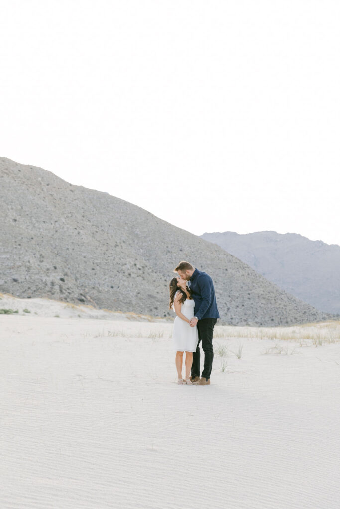 cute newly engaged couple at their photoshoot in joshua tree