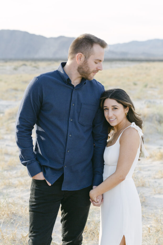 couple posing for engagement photos at palm springs