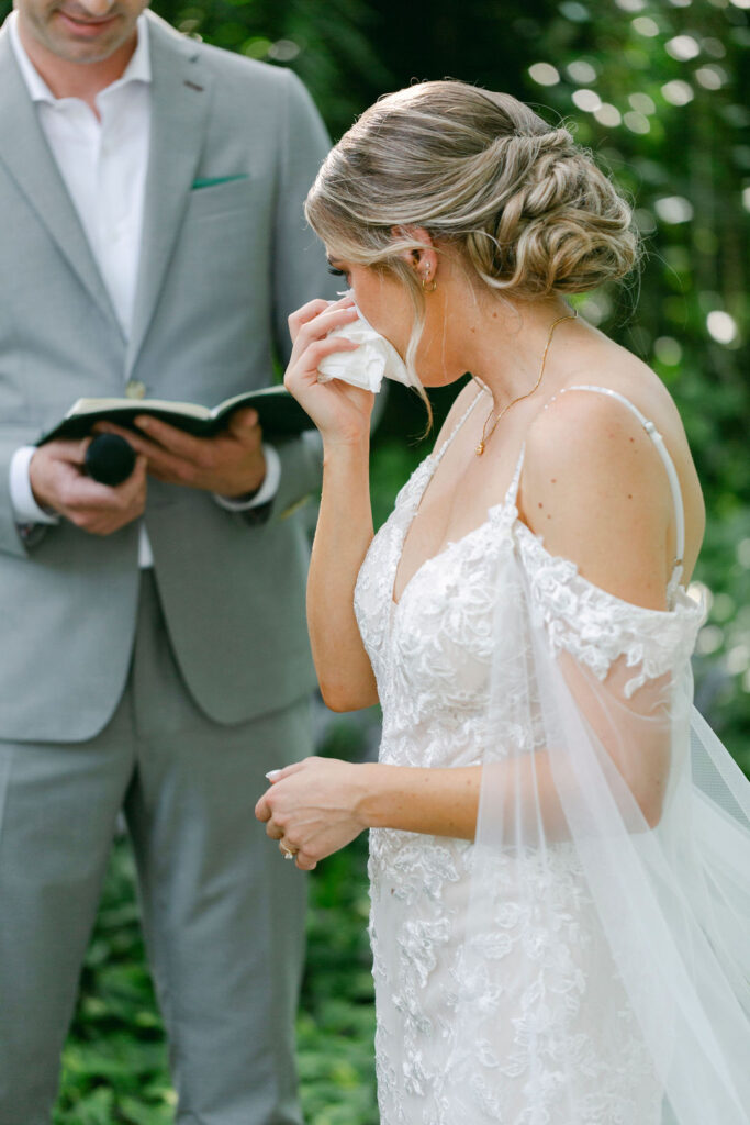 bride emotional at the ceremony 