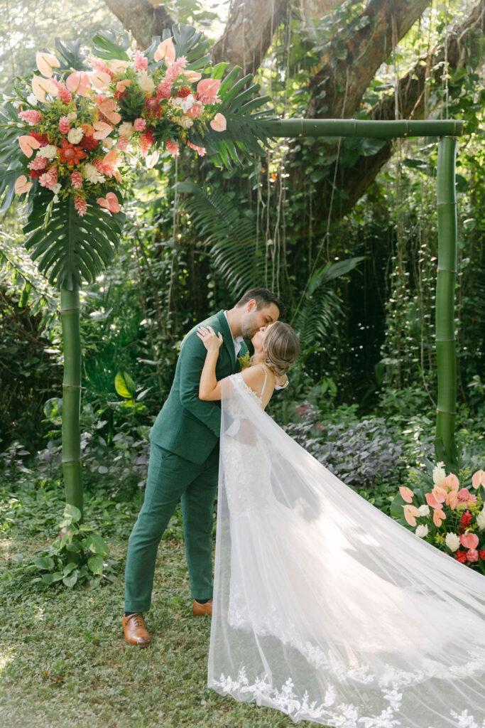 bride and groom kissing after their wedding ceremony 