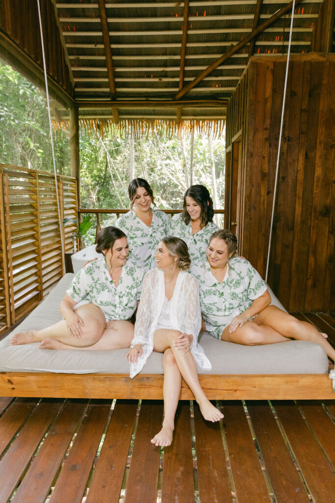 bride and her bridesmaids before getting ready for the ceremony 