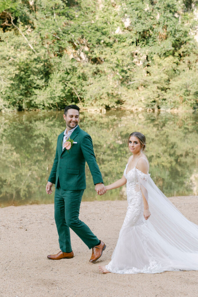 cute picture of the bride and groom holding hands