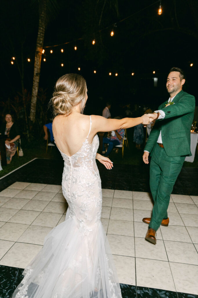 cute couple dancing at their tropical wedding