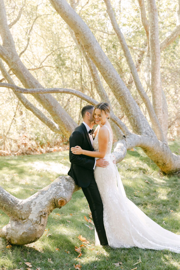 groom kissing the bride on the cheek