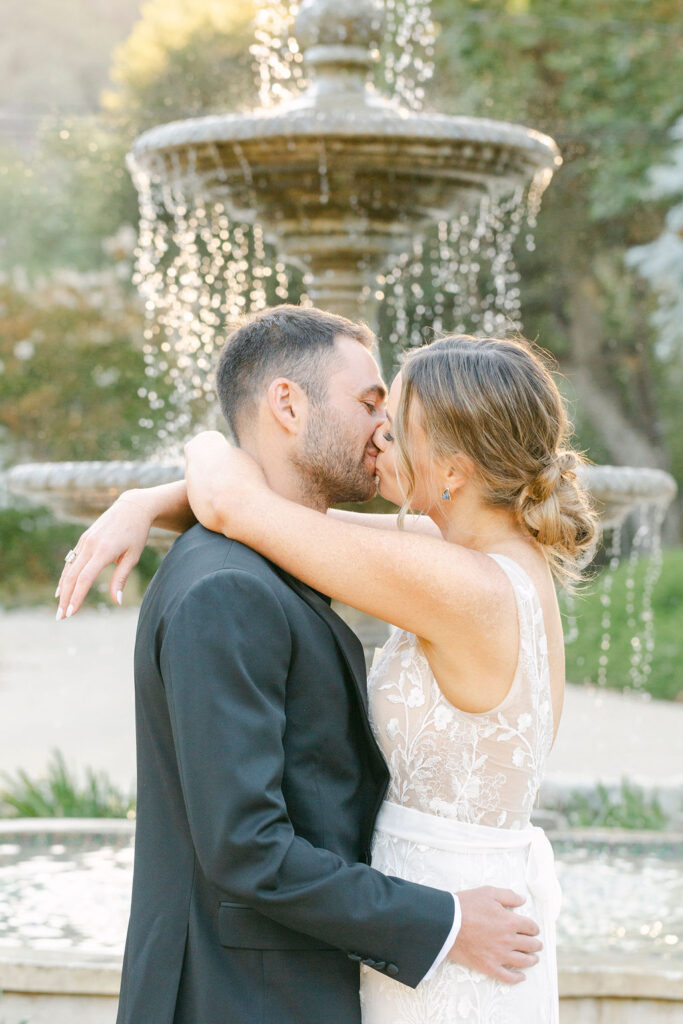 portrait of the newlyweds kissing