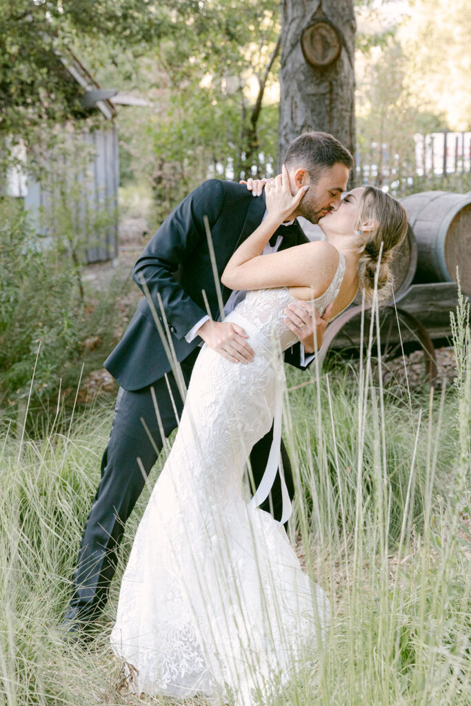 cute couple kissing during their bridal portraits