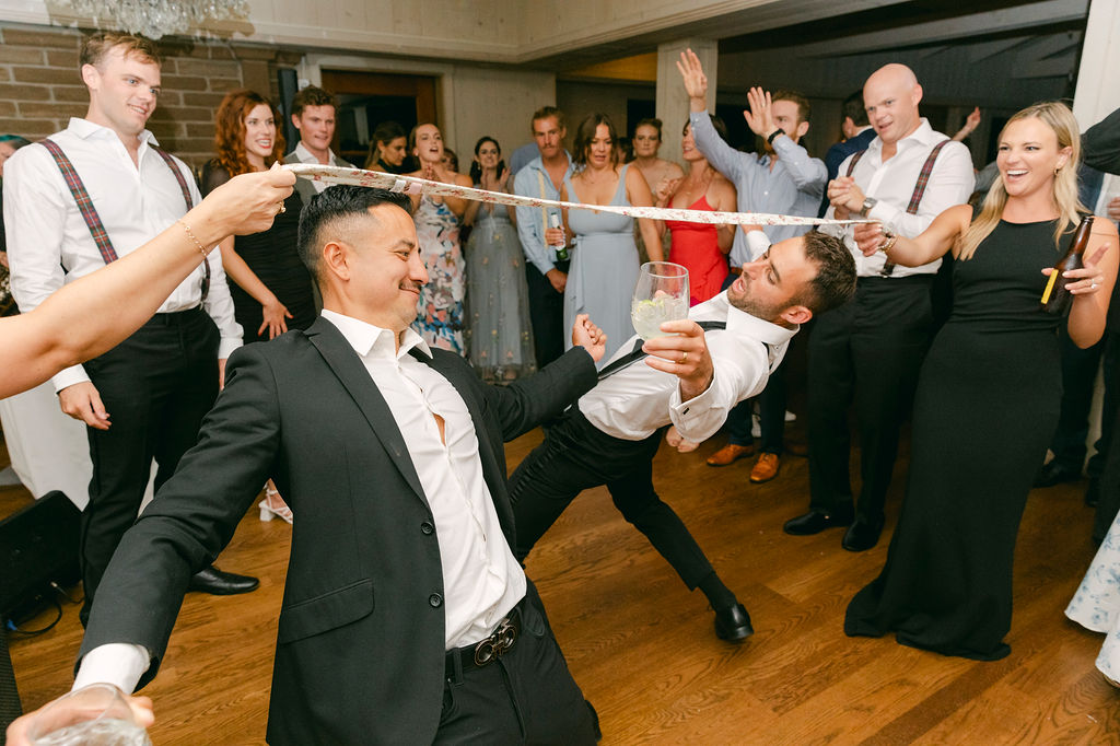 groom and his friends dancing at the reception party