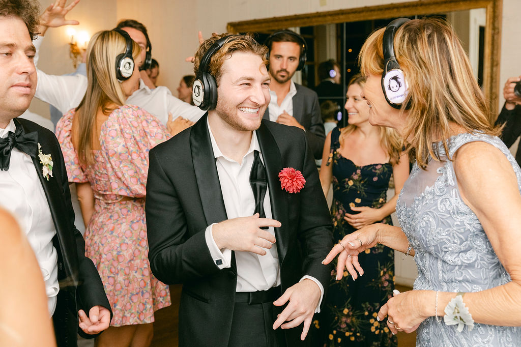 groom and his guests dancing at the wedding party