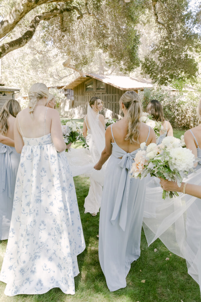 bride walking with bridesmaids at carmel wedding day