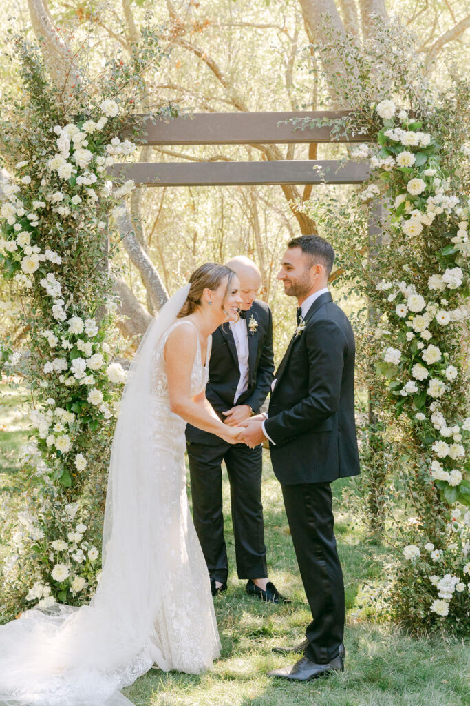 bride and groom laughing at their ceremony