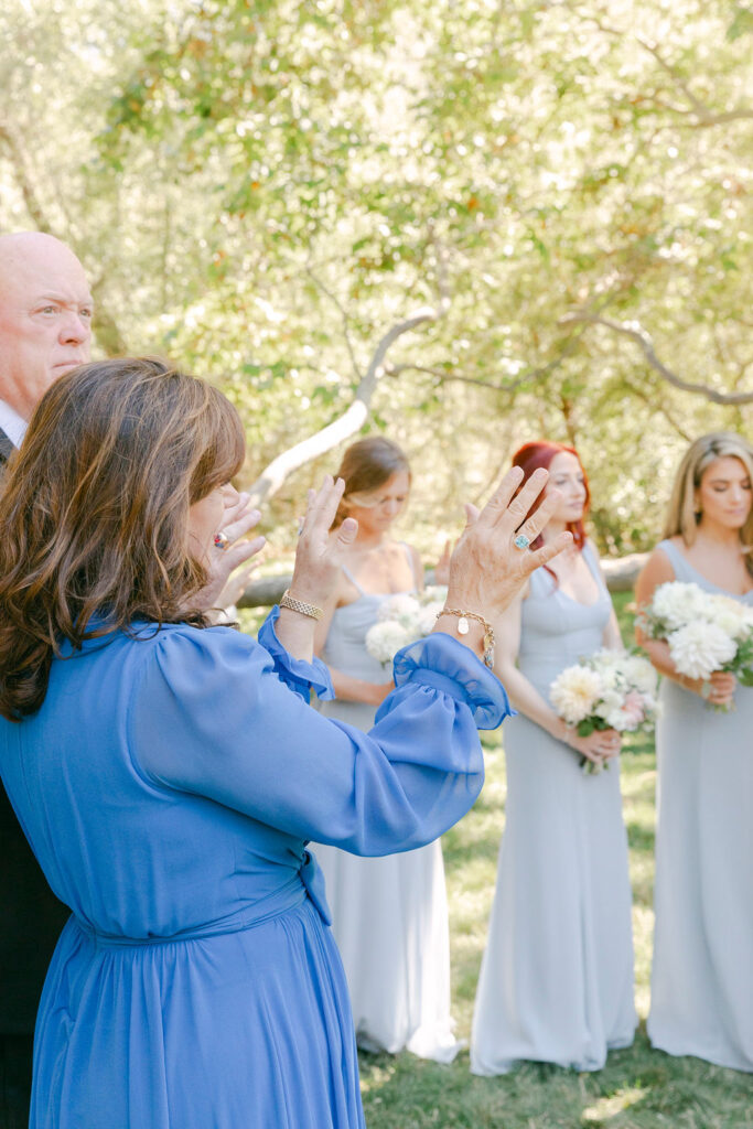 wedding guests praying for the bride and groom