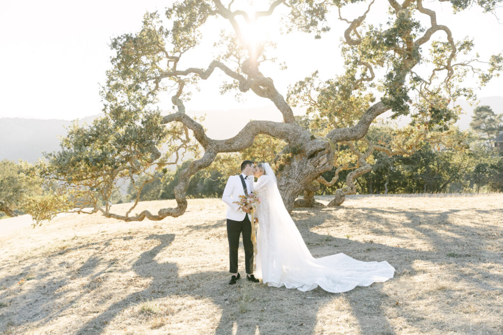 bride and groom standing next to each other during wedding photos in carmel