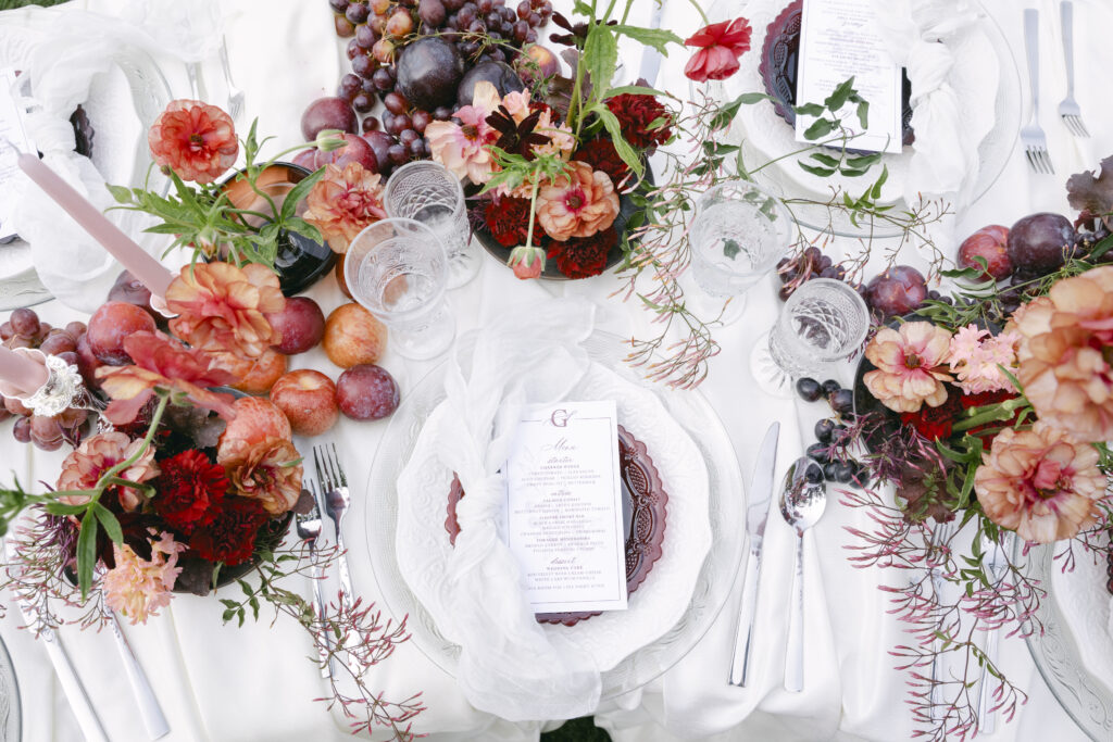 wedding reception table with bold red as it's primary color.