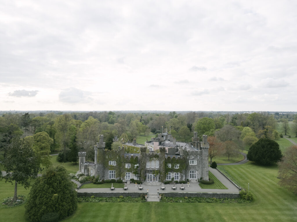 Aerial view of Luttrellstown Castle wedding venue surrounded by green Irish countryside near Dublin.