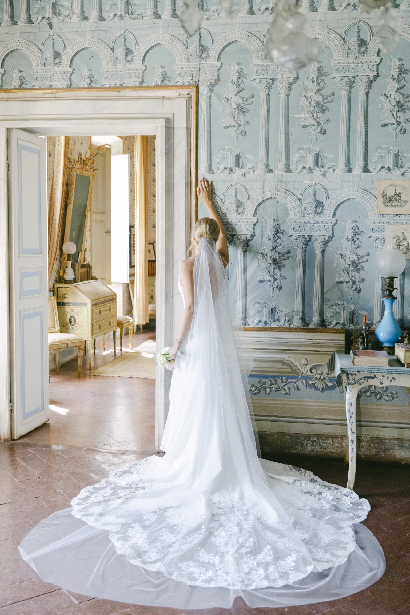 Bride posing during morning bridal portraits at her luxurious Italy wedding at Villa di Geggiano wedding venue.